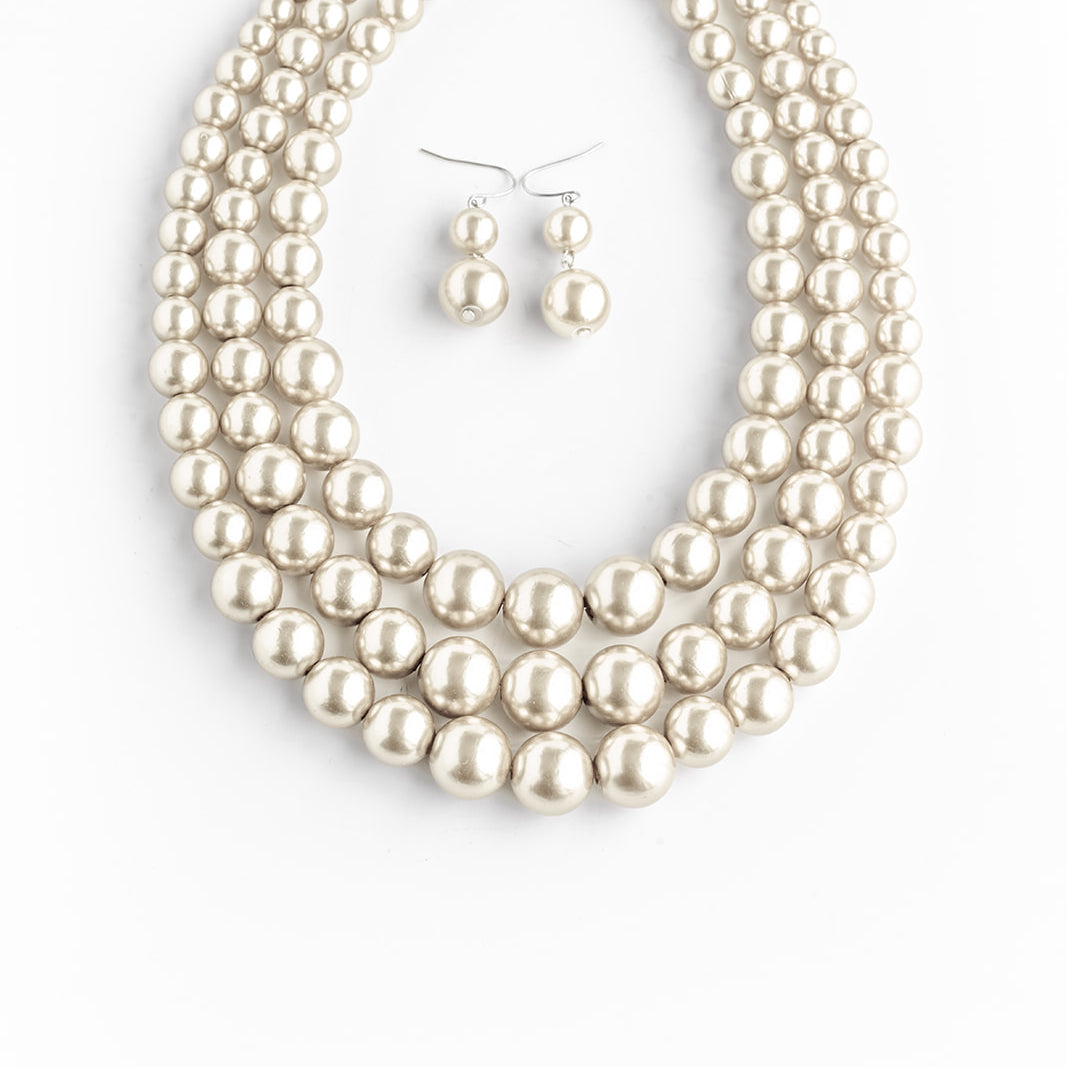 THREE STRAND PEARLS AND EARRINGS